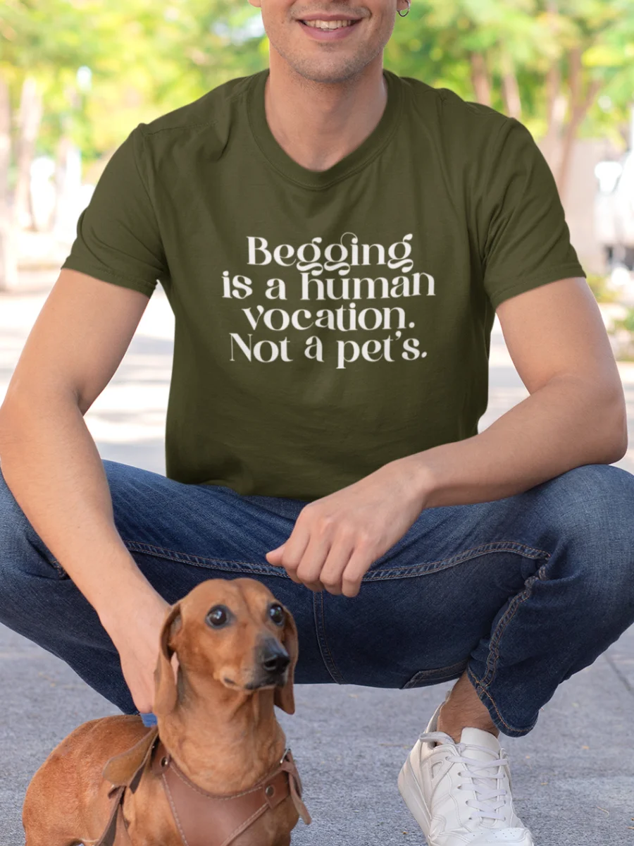 “Begging is a human vocation. Not a pet’s.” typography graphic printed in white on an olive green t-shirt with a dachshund dog | Smolt