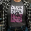 “bikey bikey likey likey” retro motorcycle typography graphic printed in white and pink on an asphalt grey t-shirt | Smolt
