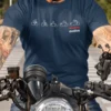 Motorcycle evolution graphic with “evolve” typography printed in white and red on a navy blue t-shirt | Smolt