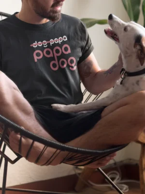 “papa dog” typography graphic with crossed-out “dog papa” text printed in pink and white on a black t-shirt | Smolt